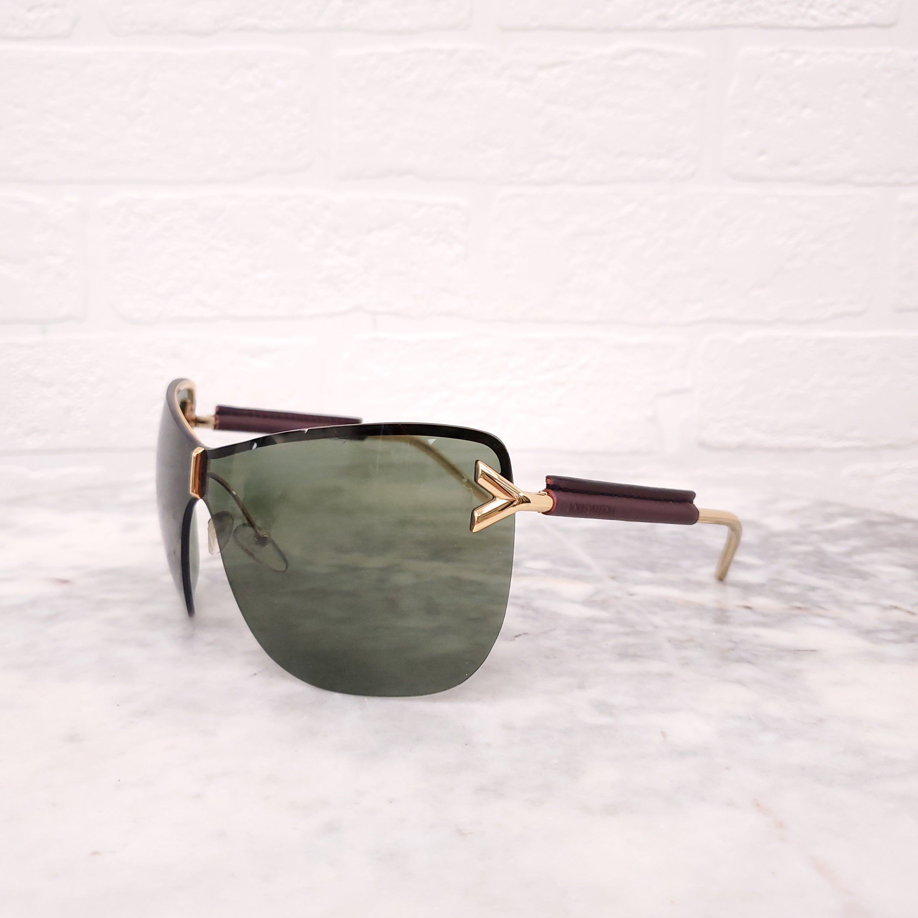 LOUIS VUITTON MASK LOGO SUNGLASSES WITH LEATHER DETAIL